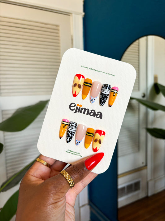 Back to School press-on nail set featuring 3D apple, notebook, notebook paper, crayon and pencil design. Durable, easy to apply, and perfect for celebrating the academic season.