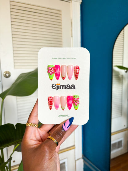 delicate orchid blooms and tropical elements. Lush greens, vibrant purples, and subtle white accents recreate the beauty of an island paradise. These sophisticated yet striking nails bring a touch of tropical luxury to any occasio